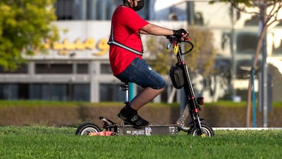 Modified e-scooters with seats have become a common sight. Abu Dhabi authorities have banned such models amid concerns over the effect on the rider's balance. Victor Besa / The National