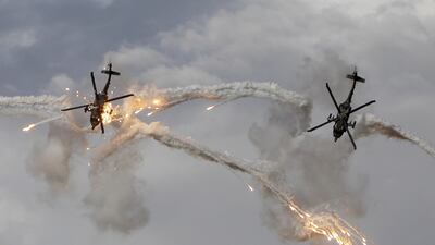 Helicopters from the Arpia 51 aerobatic team of the Colombian Air Force perform during the Aeronautical Fair in Rionegro, Colombia. EPA