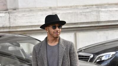 British Formula One driver Lewis Hamilton arrives at Stella McCartney's spring-summer 2016 ready-to-wear fashion collection presented during the Paris Fashion Week, Monday, Oct. 5, 2015 in Paris, France. (AP Photo/Zacharie Scheurer)