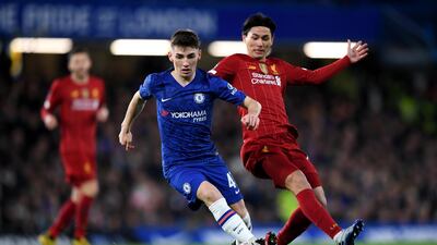 Billy Gilmour begins to bribble the ball away from Takumi Minamino. Getty Images