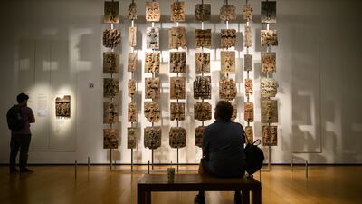 Items from a collection of metal plaques and sculptures taken from modern-day Nigeria in 1897, commonly referred to as the Benin Bronzes, are seen in a gallery of African relics in 2023