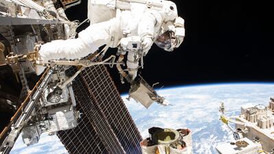 In this photo provided by Nasa, astronaut Mark Vande Hei performs a spacewalk to lubricate the Canadarm2 on October 10, 2017. AP