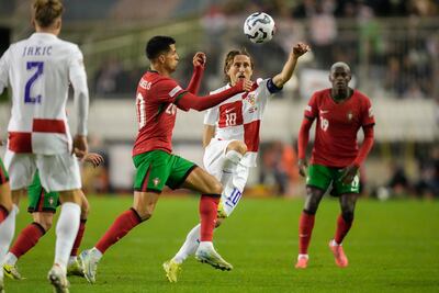 Croatia's Luka Modric vies for the ball with Portugal's Joao Cancelo. AP