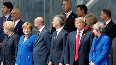 (LtoR) Lituania's President Dalia Grybauskaite, German Chancellor Angela Merkel, Belgium's Prime Minister Charles Michel, NATO Secretary General Jens Stoltenberg, US President Donald Trump and Britain's Prime Minister Theresa May attend the opening ceremony of the NATO (North Atlantic Treaty Organization) summit, at the NATO headquarters in Brussels, on July 11, 2018. / AFP / GEOFFROY VAN DER HASSELT
