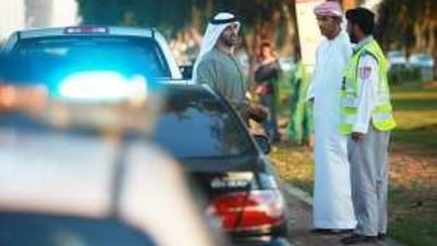 Abu Dhabi police officers demonstrate a new traffic campaign using unmarked cars.