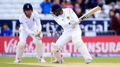 England’s Moeen Ali bowls Sri Lanka’s Dinesh Chandimal, right, during Day 3 of the first Test cricket match at Headingley, Leeds, England, Saturday, May 21, 2016. (Nigel French/PA via AP)