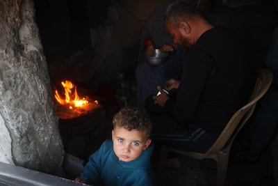 A family prepares an iftar meal in the Bureij camp for Palestinian refugees in central Gaza. AFP