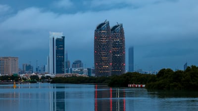 Dark clouds cast a shadow over Abu Dhabi. Victor Besa / The National