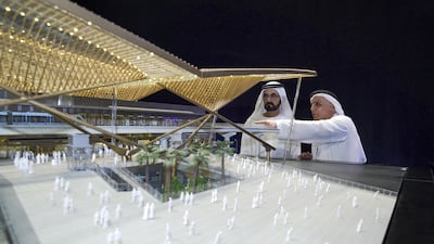 Mattar Al Tayer shows Sheikh Mohammed bin Rashid the design for the main expo station. Wam