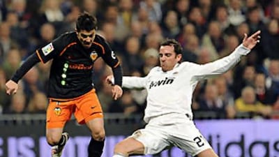 Christoph Metzelder, right, tackles David Villa of Valencia in a recent game. The defender is hoping to become an important player for Real under Juande Ramos.