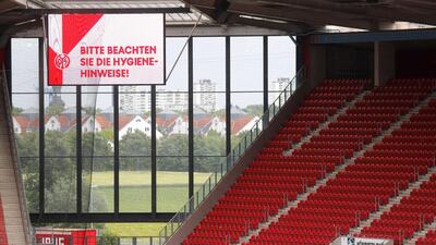 A message on a scoreboard reads "Please be aware of the hygiene advice" before the match. AFP