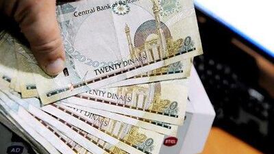 Kingdom Bahrain, Manama, 25/8/10. Bahrain currency in cash being counted. Photo by Phil Weymouth for The National