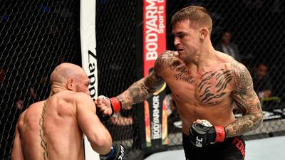 Dustin Poirier and Conor McGregor during their lightweight fight at UFC 257.