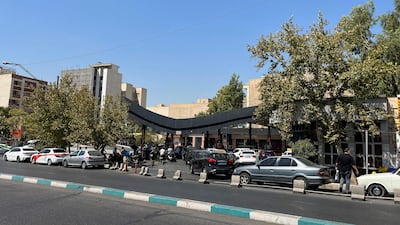 Drivers queue at a petrol station in Tehran. Iran's economy, used to decades-old hardships due to sanctions, is now bracing for another round from the US. AFP