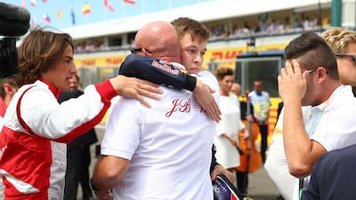 Red Bull Racing's Daniil Kvyat consoles Jules Bianchi’s father, Philippe, after a minute’s silence was observed in tribute to the late driver before the Grand Prix of Hungary. Mark Thompson / Getty Images