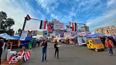 The protester camp gather in Baghdad's Tahrir Square. AP