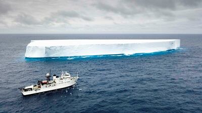 A boat sails past an Iceberg in the Southern Ocean. Courtesy: The Five Deeps Expedition