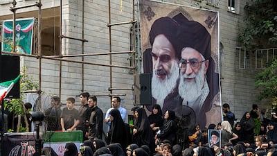 Iranians gather outside a building targeted in the Israeli strikes to mourn and show solidarity with the families of the victims on July 14, 2025 in Tehran. Getty