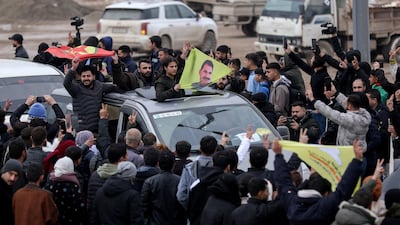 People welcome SDF civilians and fighters following the ceasefire. Reuters