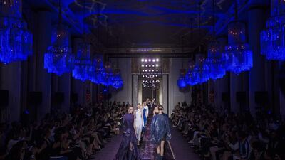 Models present creations from the Haute Couture Fall-Winter 2014/15 collection by Italian designer Donatella Versace for Versace fashion house during the Paris Fashion Week, in Paris, France on July 6, 2014. The presentation of the Women's Haute Couture collections runs from 06 to 10 July.vIan Langsdon / EPA