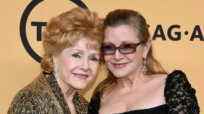 Debbie Reynolds, left, and Carrie Fisher. Getty Images / AFP
