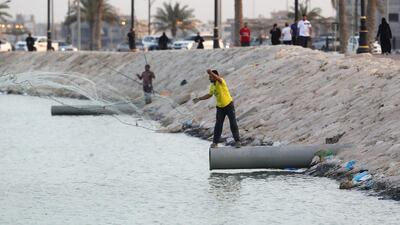 People fish after Saudi Arabia imposed a temporary lockdown on the province of Qatif, following the spread of coronavirus, in Qatif, Saudi Arabia. REUTERS