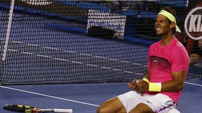 Rafa Nadal sinks to his knees after coming through a five-set battle to reach the third round of the Australian Open. Thomas Peter/Reuters