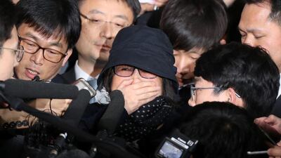 Choi Soon-sil, centre, who is at the centre of a political scandal in South Korea, is surrounded by the media upon her arrival at a prosecutor's office in Seoul, South Korea on October 31, 2016. Seo Myeong-gon/Yonhap via Reuters