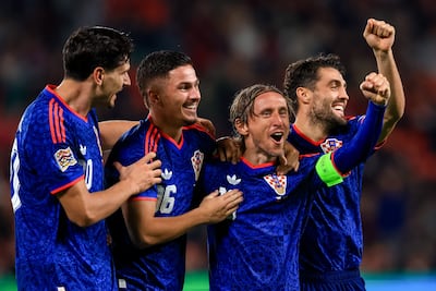 Croatia captain Luka Modric, second right, celebrates scoring against Czechia. EPA