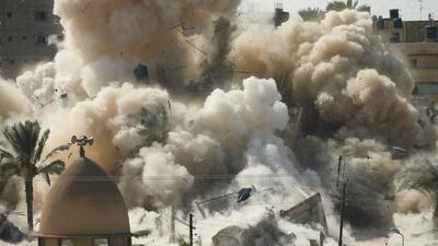 Smoke rises after a house is demolished during a military operation by Egyptian security forces in Rafah, near the border with southern Gaza Strip. Egypt has started its plans to build a buffer zone in the border area after at least 33 Egyptian security personnel were killed on Friday in the Sinai Peninsula bordering Israel and Gaza. Suhaib Salem/Reuters