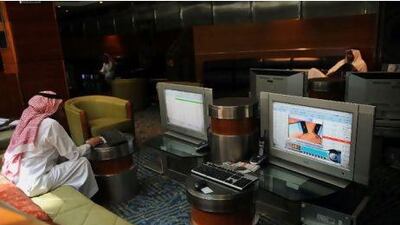 A Saudi investor monitors stocks at the exchange market department at the Saudi Investment Bank. AFP