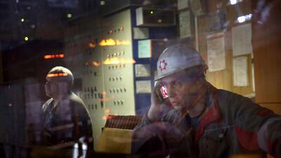 Employees work in a control room at the Ilyich Iron and Steel Works. Rinat Akhmetov, the owner of the factory and richest man in Ukraine, has enlisted his 300,000 employees to end the turmoil unleashed by the armed takeover of pro-Russian separatists in Mairupol. John Moore / Getty Images