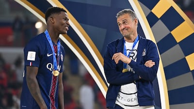 Head coach Luis Enrique and Nuno Mendes of Paris Saint-Germain. EPA