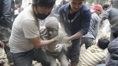 A man is freed from the rubble of a destroyed building after an earthquake hit Nepal, in Kathmandu. A 7.9-magnitude earthquake rocked Nepal destroying buildings in Kathmandu and surrounding areas, with nearly 2,000 expected dead. The epicentre was 80 kilometres northwest of Kathmandu. Narendra Shrestha / EPA