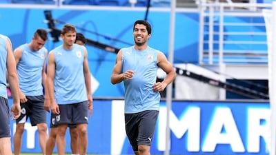 Luis Suarez of Uruguay smiles during a training session on Monday ahead of Uruguay's match on Tuesday with Italy at the 2014 World Cup in Natal, Brazil. Claudio Villa / Getty Images / June 23, 2014