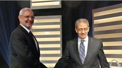 Amr Moussa, right, and Abdelmoneim Abul Fotouh, traded barbs during Thursday's presidential debate - the first of its kind in Egypt.