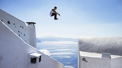 Aleksandr Baiturin of Russia performing during the preshoot at Oia area on the island of Santorini, Greece, on October 2, 2014. EPA