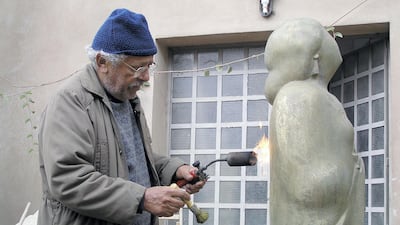 Adam Henein working on a sculpture of Umm Kulthum, circa 2009. Karim Francis Gallery, Cairo