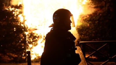 A French riot officer during a third night of violence over the police shooting of a 17-year-old in Nanterre. AP