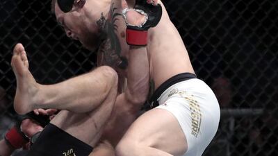 Conor McGregor, right, fights Eddie Alvarez during a lightweight title mixed martial arts bout at UFC 205, early Sunday, November 13, 2016, at Madison Square Garden in New York. Julio Cortez / AP Photo