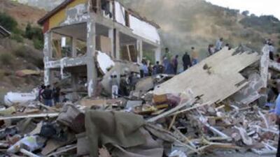 Rescue workers search for survivors in the rubble of a collapsed dormitory in the village of Balcilar, near the central Turkish city of Konya, on Friday, Aug 1, 2008.