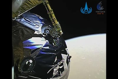 This screengrab taken from handout video received from the China National Space Administration on February 13, 2021 shows the view of Mars from China's Tianwen-1 spacecraft as it circles the planet in space on February 12. AFP / CNSA