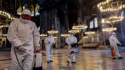 Employees of the Fatih Municipality disinfect the Hagia Sophia to prevent the spread of the COVID-19, caused by the novel coronavirus, in Istanbul. AFP