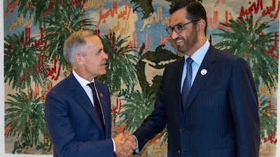 Dr Sultan Al Jaber, Minister of Industry and Advanced Technology and chairman of Masdar, with Mark Carney, chair and head of transition investing at Brookfield. Photo: Masdar