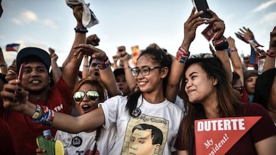 Supporters of Rodrigo Duterte take 'selfies' at an election campaign rally ahead of the Philippine presidential elections in Manila earlier this month. Duterte won the vote in a landslide victory. Mohd Rasfan / AFP.