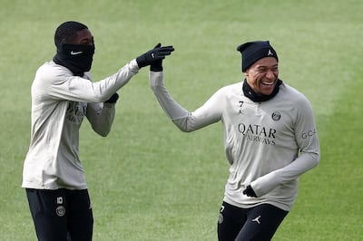 Paris Saint-Germain's Ousmane Dembele during training with Kylian Mbappe. AFP