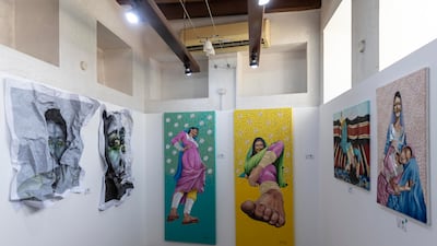 Paintings by Mai Majdy, centre, part of the Round exhibition at Sikka, which includes works by Faisal Al Rais, Moza Al Falasi, Ali Jamal, among others.