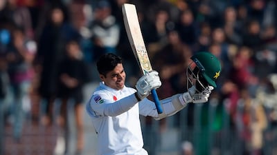 Abid Ali acknowledges the crowd after reaching fifty at the Pindi Cricket Stadium on Sunday. AFP