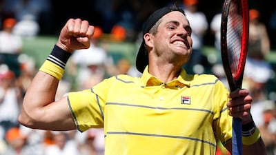 John Isner celebrates winning the Miami Open final. Rhona Wise / EPA