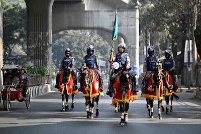 Police personnel patrol on horses along a street during Bangladesh's general election in Dhaka. AFP